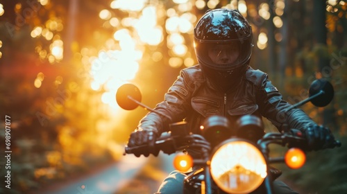 A man wearing a helmet and riding a motorcycle photo