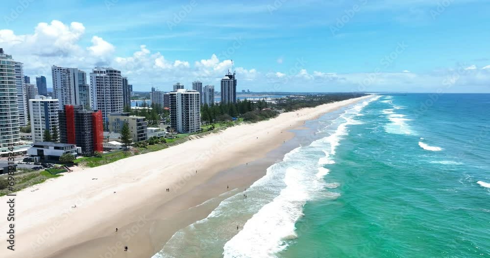 Cityscape of the iconic high-rise skyline looking north to crashing waves. Surfers Paradise, Gold Coast, Queensland Australia Cityscape of the iconic high-rise skyline looking north to crashing waves. Surfers Paradise, Gold Coast, Queensland Australia