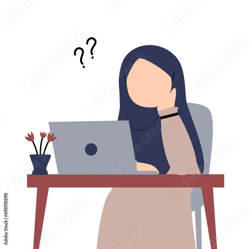 Hijabi girl working on laptop while virtual meeting