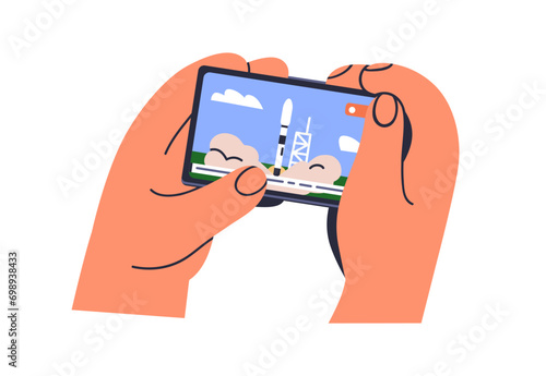 Mobile phone in hands, watching live news, online video broadcast. Holding sm...