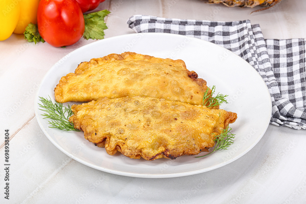 Homemade fried cheburek with meat Homemade fried cheburek with meat