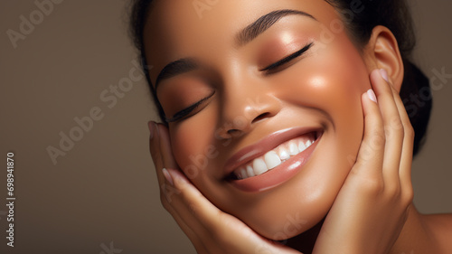 A beautiful black woman is applying cosmetics and smiling brightly. grooming. cosmetics photo, beauty industry advertising photo. photo