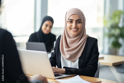 Obraz na płótnie Asian Muslim female hr manager wearing hijab giving interview w salonie