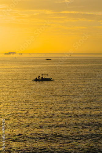 boat on the sea at sunrise