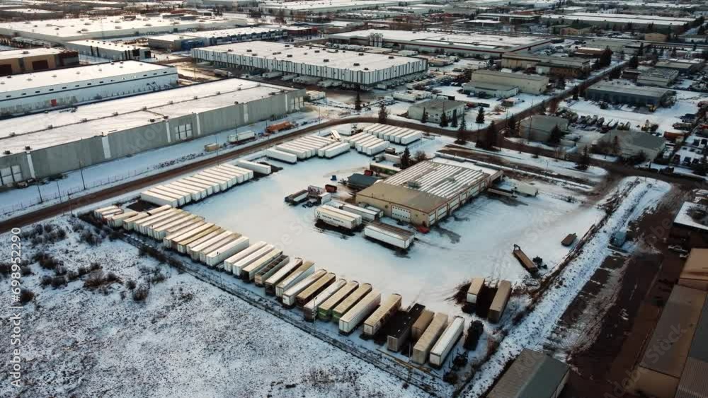 Outdoor warehouses with trailers parked closely together in the middle of winter. Outdoor warehouses with trailers parked closely together in the middle of winter.