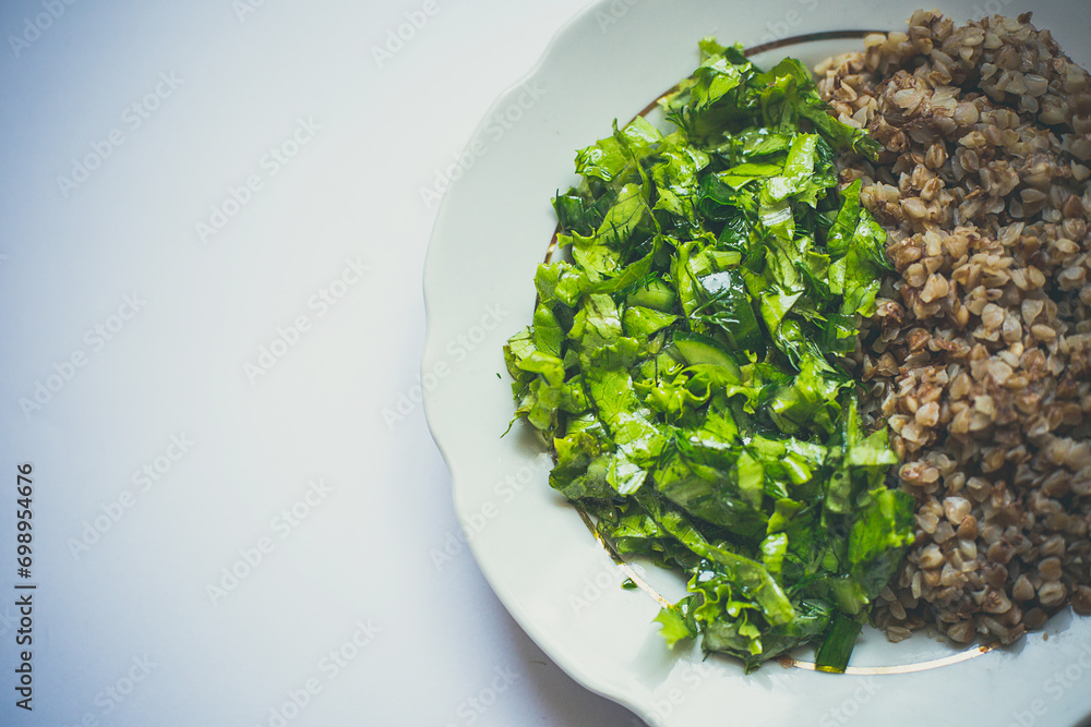 Plate of cooked buckwheat, healthy eating Plate of cooked buckwheat, healthy eating