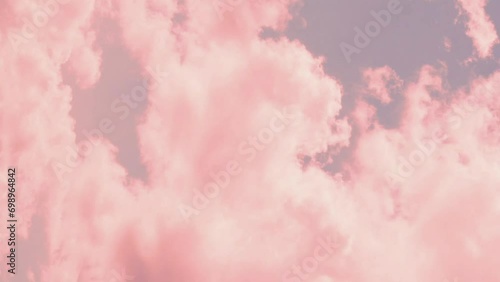 Vertical. Beautiful Colored Cumulus Clouds at Sunset in A Blue Lilac Sky Time Lapse, Background, Colorful Atmosphere. Cloudy Evening Skyscraper, Timelapse, Aerial View. photo