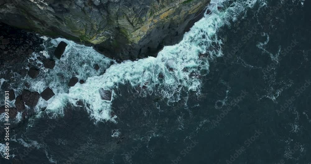 White waves crash against high rocks in 4k White waves crash against high rocks in 4k