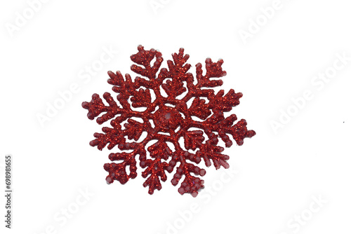 A red snowflake on a white background. Attribut of Christmas and New Year holidays. The set for the Christmas tree is red snowflake with blisters on a white background