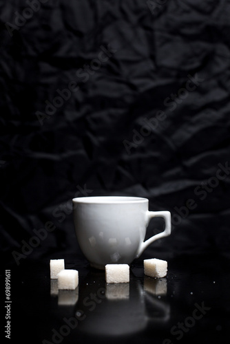 Cup of coffee on black background