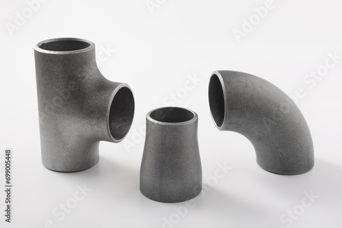 on a white background steel butt welding pipe fittings elbow and tee, reducer