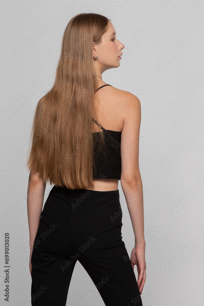 Fototapeta premium Blonde model girl with long hair in profile.