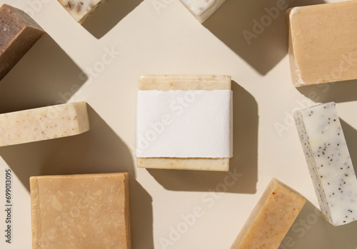 Картината върху платно Beige and brown soap bars on light beige close up, hard shadows, packaging mocku