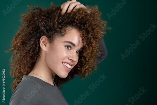 beautiful smiling curly young woman