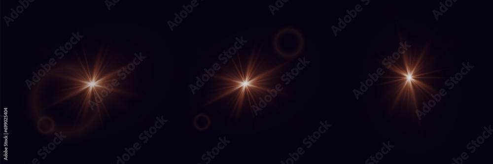 Explosion light effect. Glare of light rays. Light solar flare. On a black background.