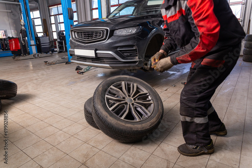 Working inside tire service center. © BY-_-BY