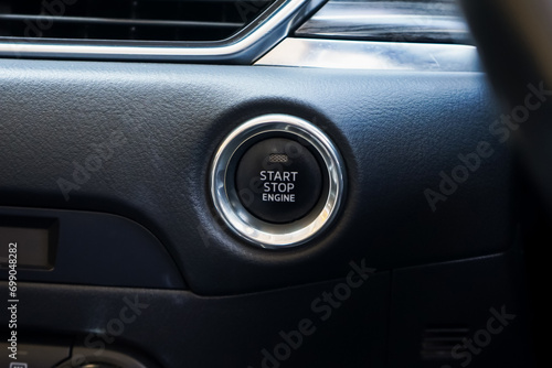 Close up engine car start button. Start stop engine modern new car button,Makes it easy to turn your auto mobile on and off. a key fob unique ,selective focus  © Muanpare
