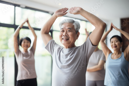 Elderly Residents Engage In Fitness Class As Part Of Their Exercise Routine