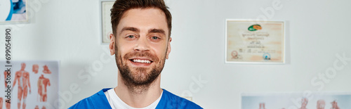 jolly good looking doctor with beard posing and smiling happily at camera, healthcare, banner