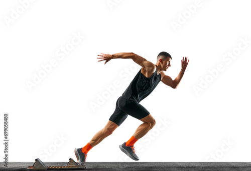 Side view body size portrait of athletic man, professional runner runs up quickly in motion against white background. Concept of sport, active lifestyle, action, victory. Ad. Copy space for text.
