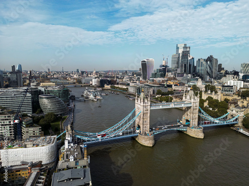 Iconic Tower Bridge Aerial drone View of Tower Bridge  Skyline. United Kingdom  UK.  Skyline of London business center the River Thames and passing above tower bridge.