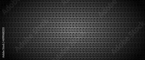 pattern with black perforated metal background for fabric design. Honeycomb pattern. Grey silver pattern. Color gradient. Modern technology. Decoration backdrop. photo