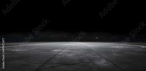 Rough textured surface with cracks in the grey concrete floor . Texture or background.