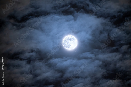 Cold Moon trough the clouds photo
