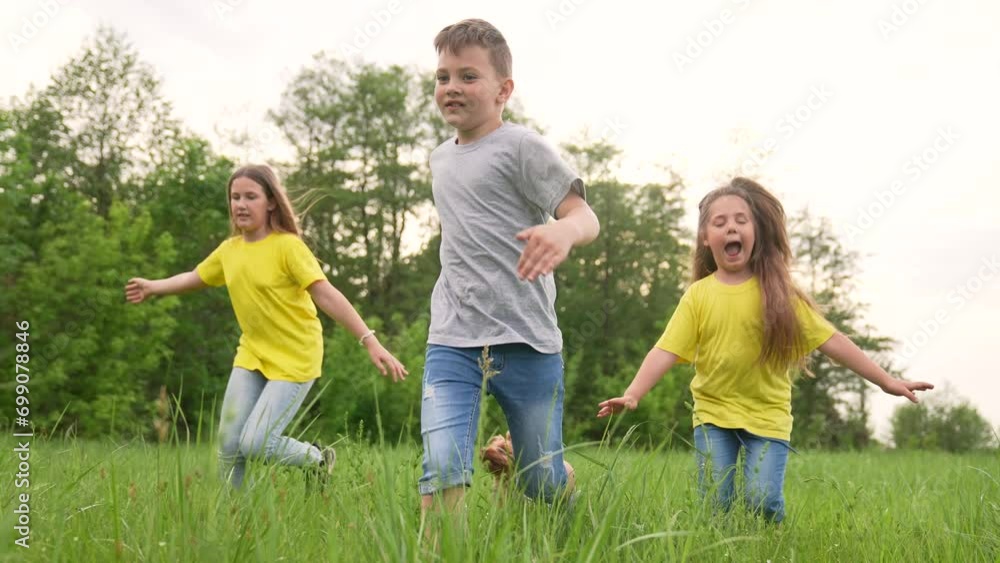 Happy family concept. portrait of running children. kids spend fun time together at school camp. educational games in park. healthy lifestyle in school camp on green grass.joint active games in nature Happy family concept. portrait of running children. kids spend fun time together at school camp. educational games in park. healthy lifestyle in school camp on green grass.joint active games in nature