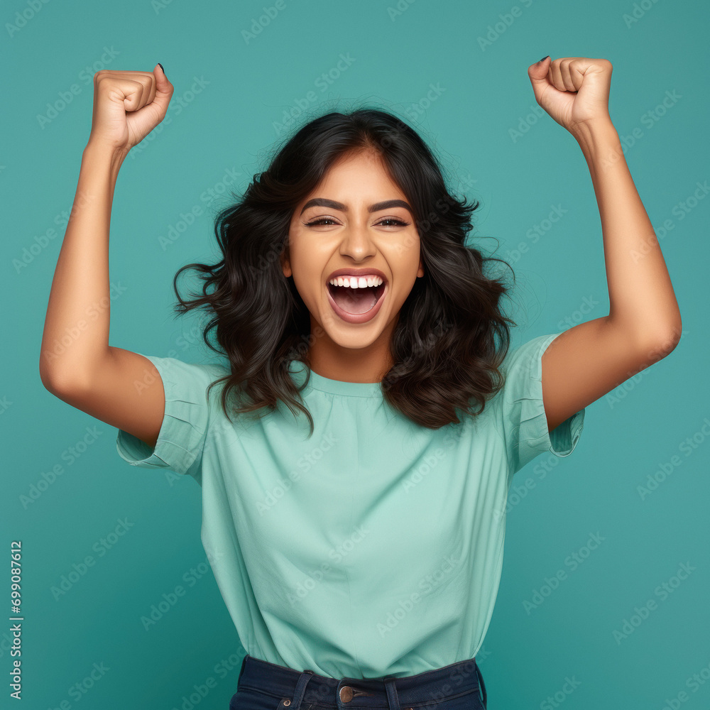 overjoyed young indian woman cheering and screaming, overjoyed young indian woman cheering and screaming,