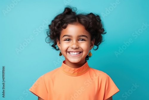 beautiful indian girl on blue color background photo
