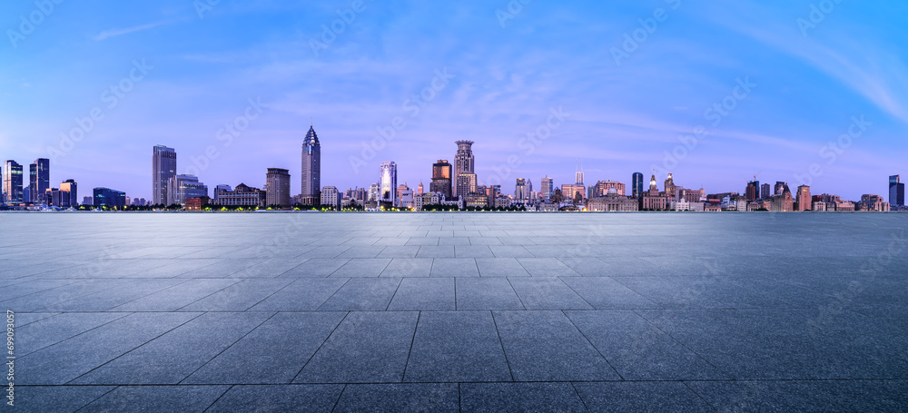 City Square floor and Shanghai skyline with modern buildings at dusk. Famous Bund architectural scenery in Shanghai. Panoramic view.