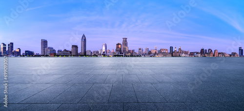 City Square floor and Shanghai skyline with modern buildings at dusk. Famous Bund architectural scenery in Shanghai. Panoramic view. photo