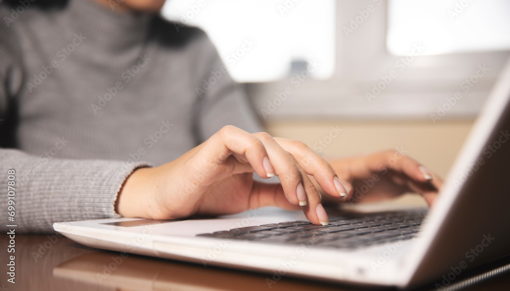 Business woman hands typing on laptop computer keyboard Business woman hands typing on laptop computer keyboard