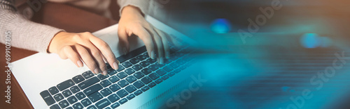 Business woman hands typing on laptop computer keyboard photo