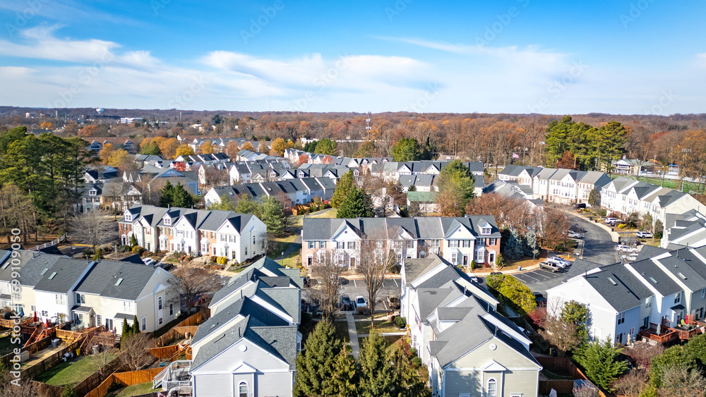 Drone Aerial Rooftop View of Small Town East Coast Community Housing in Fall with Blue Sky's and Fall Tree Colors