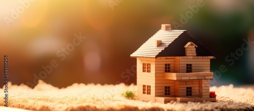 Miniature Modern house on stack of game blocks copy space house building background. Mortgage loan to buy a house or real estate property photo