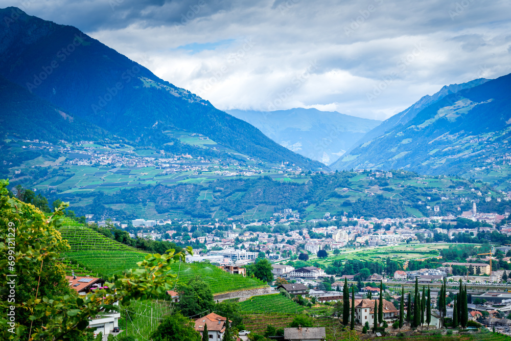 Fototapeta premium Hiking along the Marlinger Waalweg near Meran in South Tyrol Italy. With some Views over wineyards, the City of Meran, Marling and other Villages