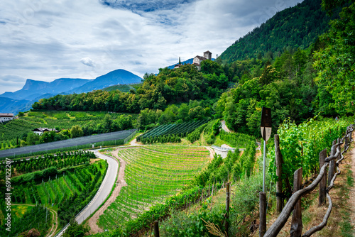 Hiking along the Marlinger Waalweg near Meran in South Tyrol Italy. With some Views over wineyards, the City of Meran, Marling and other Villages photo