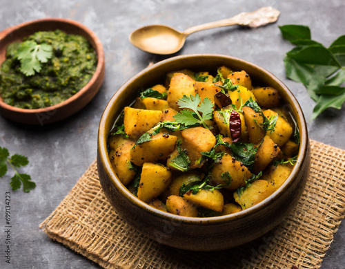 fenugreek potato sabzi or aloo methi masala is healthy indian cuisine. served in a bowl or karahi. selective focus