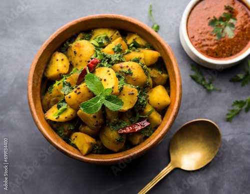 fenugreek potato sabzi or aloo methi masala is healthy indian cuisine. served in a bowl or karahi. selective focus