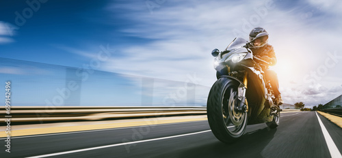 motorbike on the road riding. having fun riding the empty road on a motorcycle tour / journey