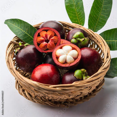 fresh kokum or garcinia indica fruit from india isolated over white or in cane basket with leaves. selective focus photo