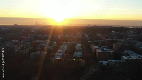 Slow aerial dolly out over Prospect Park facing south west Brooklyn at golden hour (ID: 699162469)
