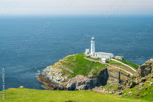 South Stack lighthouse, on Anglesey, north Wales. The lighthouse is located on a small island just off the mainland and is reached by a flight of very steep stairs. It is a bright summers day