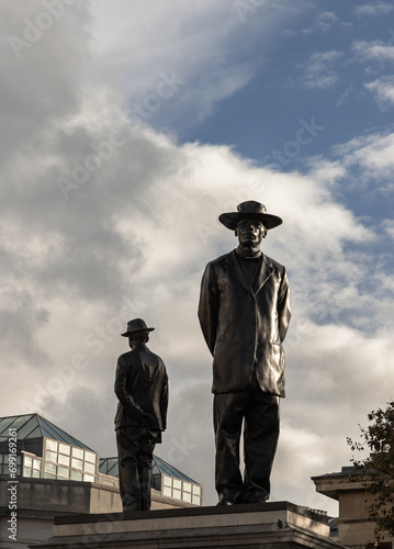 Sculpture silhouette on the fourth plinth in Trafalgar Square with sky background. Malawian Baptist Preacher and Pan-Africanist John Chilembwe and European Missionary John Chorley. Space for text, Sel photo