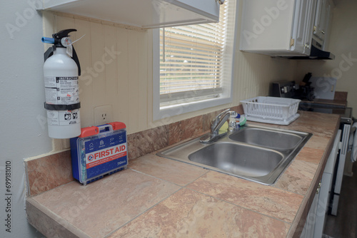 kitchen with a first aid kit and fire extinguisher 