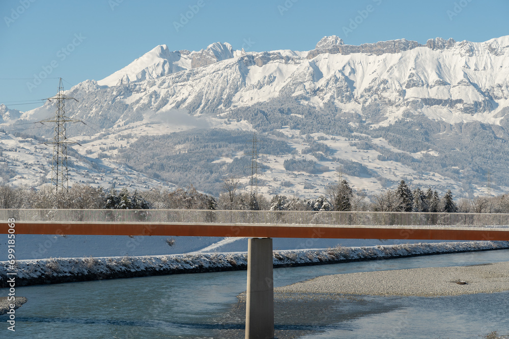 Snow covered landscape panorama at the rhine river in Vaduz in Liechtenstein
