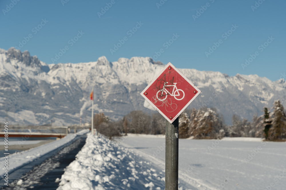 Bicycle sign at the rhine river in Vaduz in Liechtenstein Bicycle sign at the rhine river in Vaduz in Liechtenstein