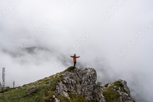 happy person standing on a mountain